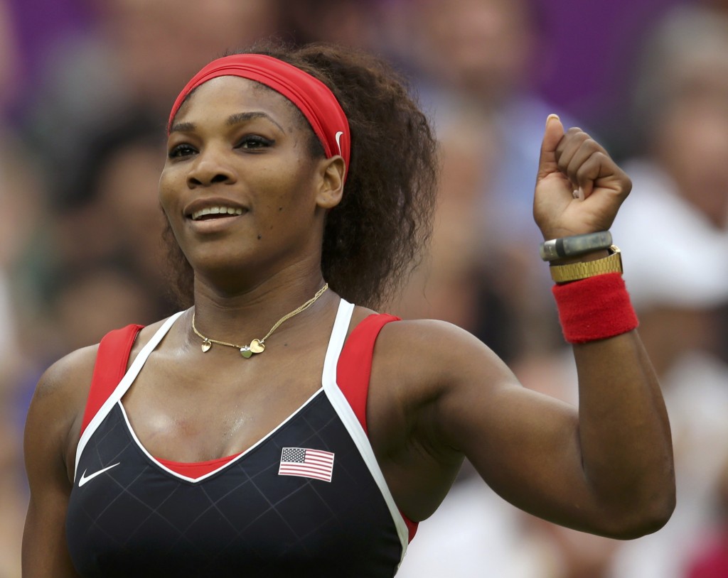 Serena Williams of the U.S. celebrates after defeating Russia's Vera Zvonareva in their women's singles tennis match at the All England Lawn Tennis Club during the London 2012 Olympic Games August 1, 2012. REUTERS/Sergio Moraes (BRITAIN - Tags: OLYMPICS SPORT TENNIS TPX IMAGES OF THE DAY)