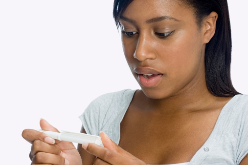Woman looking at pregnancy test