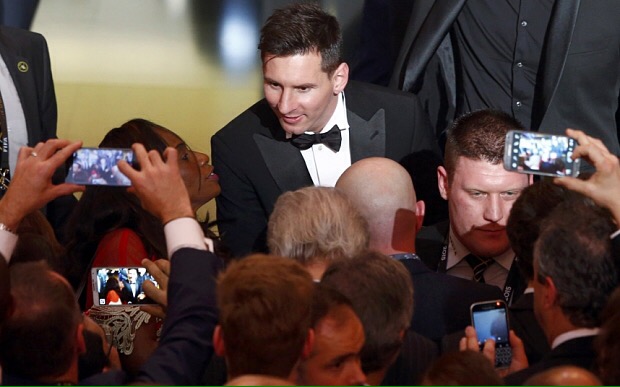 FC Barcelona's Lionel Messi of Argentina talks with guests after receiving the World Player of the Year award during the FIFA Ballon d'Or 2015 ceremony in Zurich, Switzerland, January 11, 2016. REUTERS/Arnd Wiegmann
