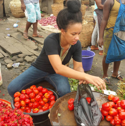 Ibinabo Fiberesima selling Tomatoes at the market