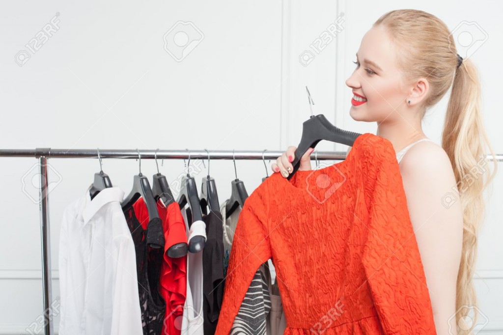 Pretty young girl is shopping in store