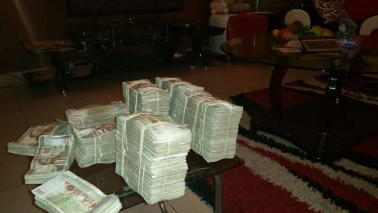 Lisa Martinez stacks of cash2