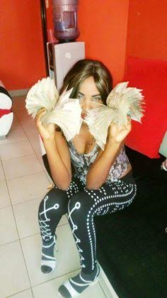 Lisa Martinez stacks of cash4