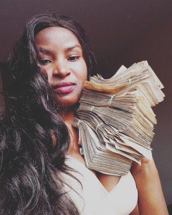 Lisa Martinez stacks of cash6