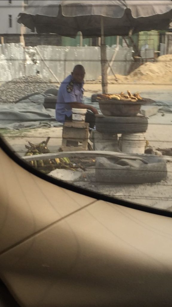 Policeman roasting plantain
