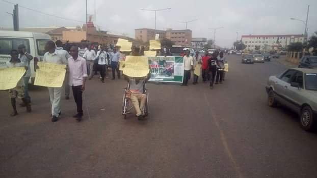 crippled and protesting