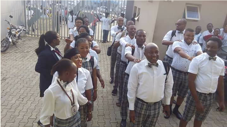 Diamond Bank staff wear school uniforms