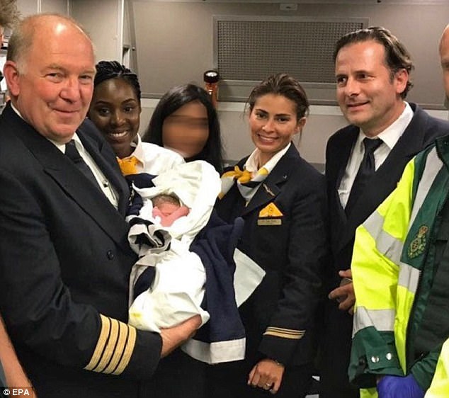 Woman gives birth aboard