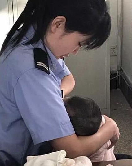 Policewoman breastfeed suspect's hungry baby