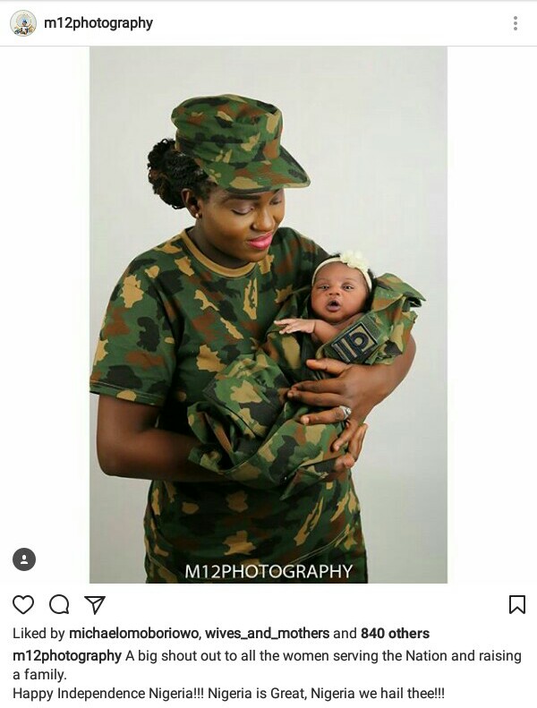 Female Nigerian soldier cradling