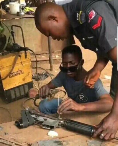 Nigerian Policeman Fixing