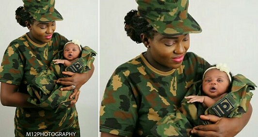 Female Nigerian soldier cradling