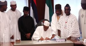 President Buhari signs