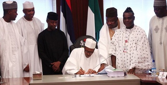 President Buhari signs