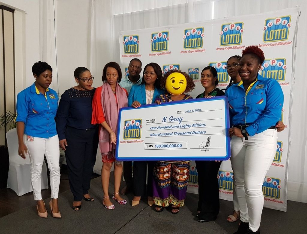 Jamaican lottery winner shows up in a mask to claim her 180 Million prize