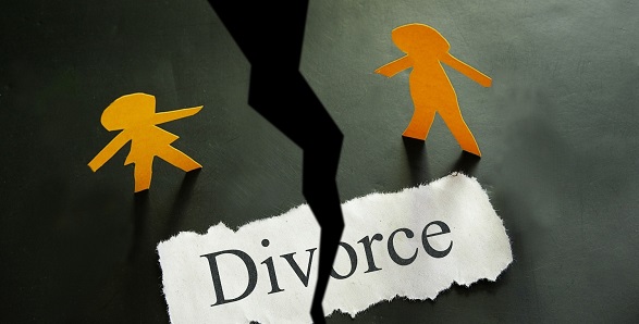 torn piece of paper with divorce text and paper couple figures Man Divorces Wife