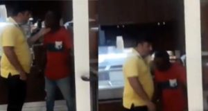 Policeman slaps man
