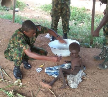 Troops rescues a malnourished child