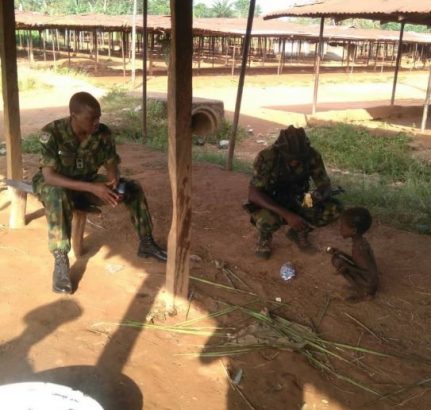 Troops rescues a malnourished child