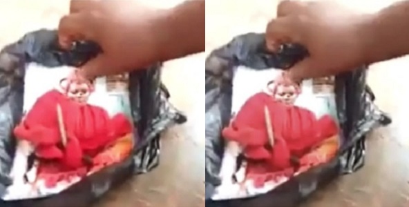 Nigerian lady finds her picture pinned with nails and juju