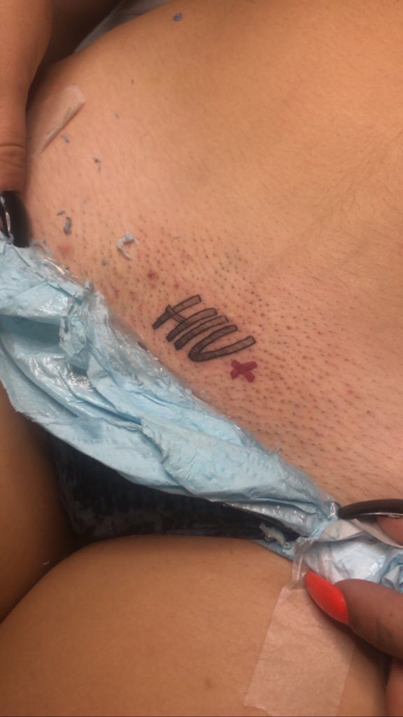 Lady tattoos HIV