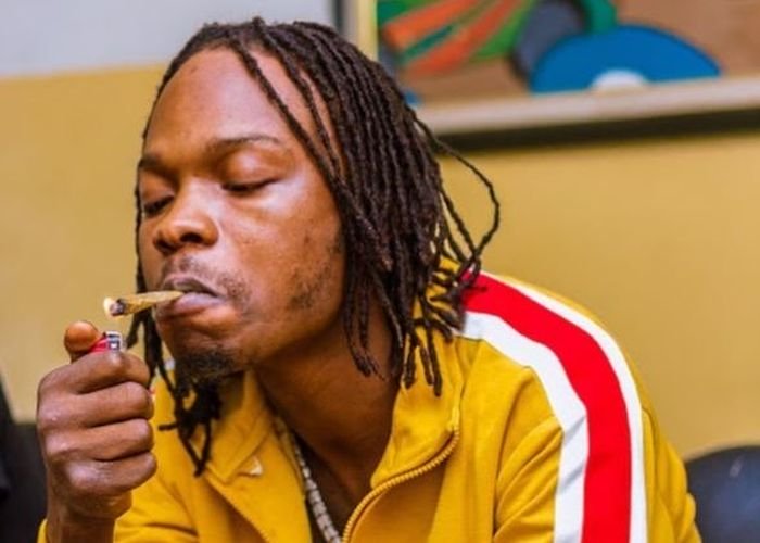 That is not me!!! – Naira Marley Denies Viral Photo Of A Look-Alike Posing With A Naked Woman