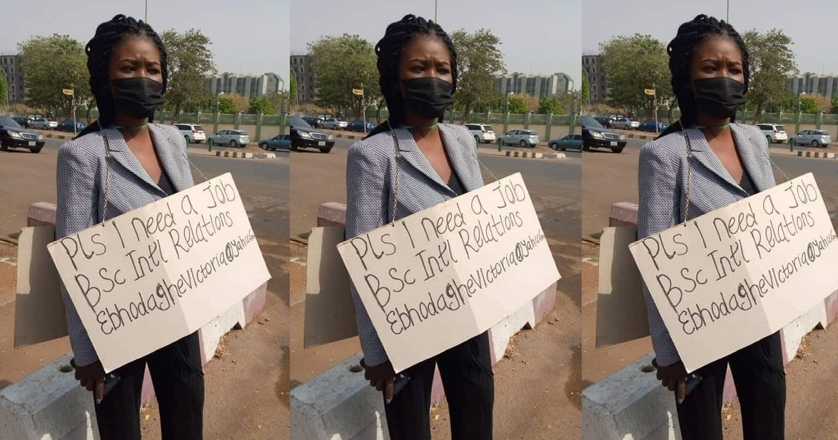 Young Nigerian lady hits Abuja street with placard to beg for job