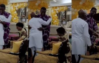 Bishop Oyedepo’s wife kneeling