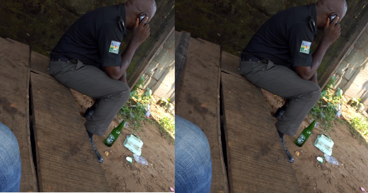 Man reacts, after a Police Officer offered him a bottle of beer.