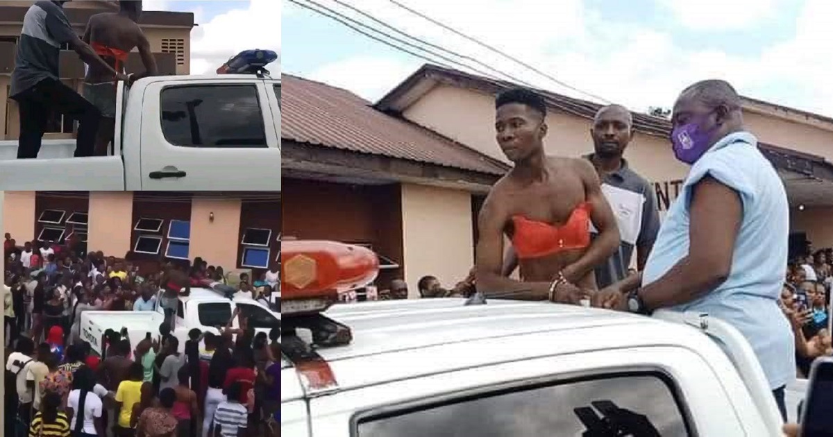 Man stripped and paraded after he disguised as a woman and snuck into female hostel in Port-Harcourt (video)