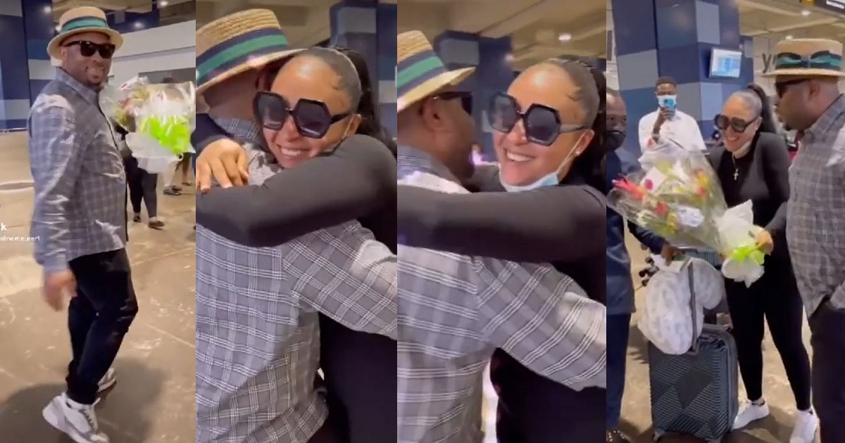 Actress, Rosy Meurer receives bouquet of flowers from her romantic husband, Olakunle Churchill, as she returns to Nigeria with their son (WATCH)