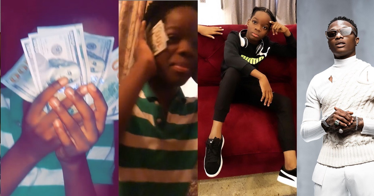 Wizkid’s son, Boluwatife, shows off the hard currency his father gave him (Video)