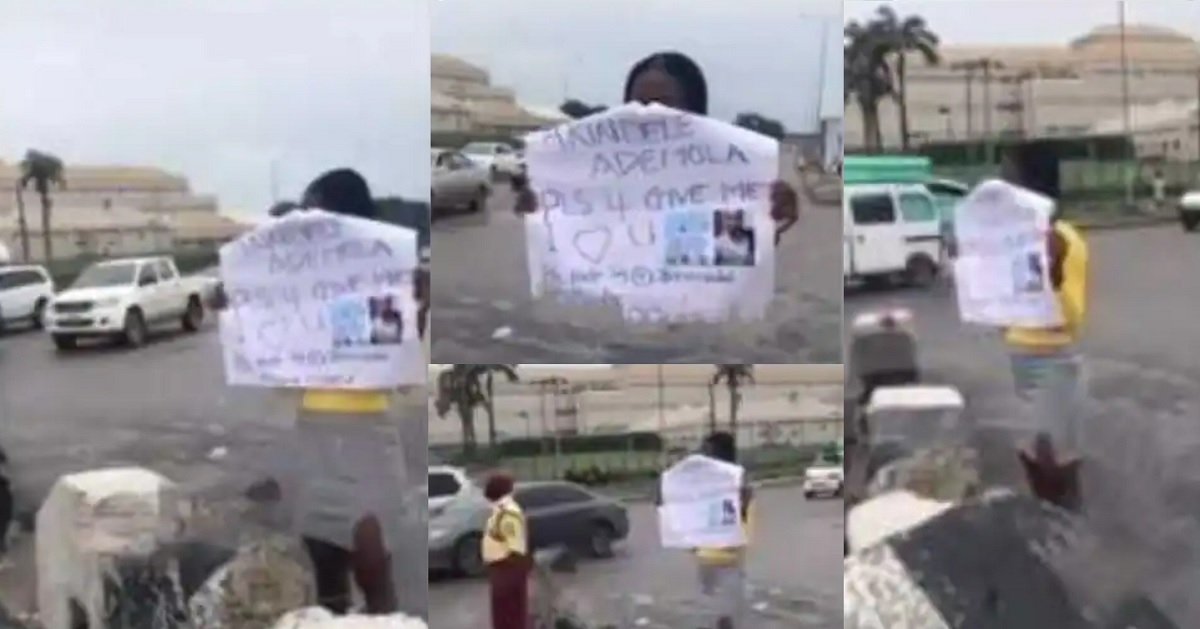 Lady storms the streets of Lagos with a placard to beg her boyfriend for forgiveness (video)