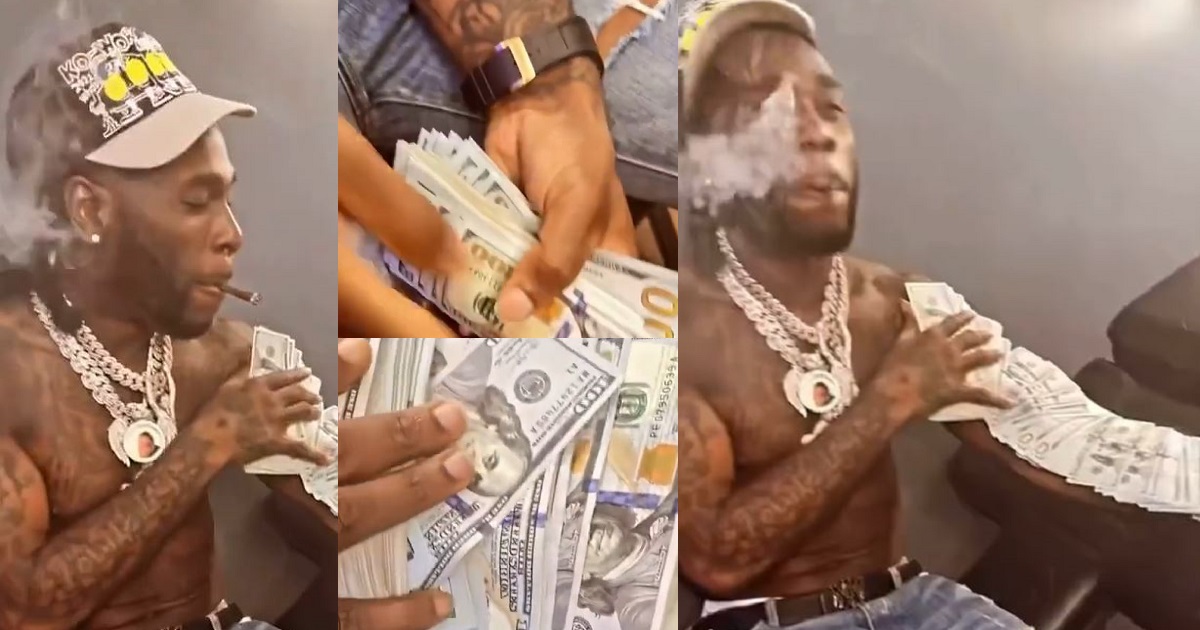 “No be em mates go Oba?” – Reactions as Burna Boy flaunts wads of dollars on social media (Video)