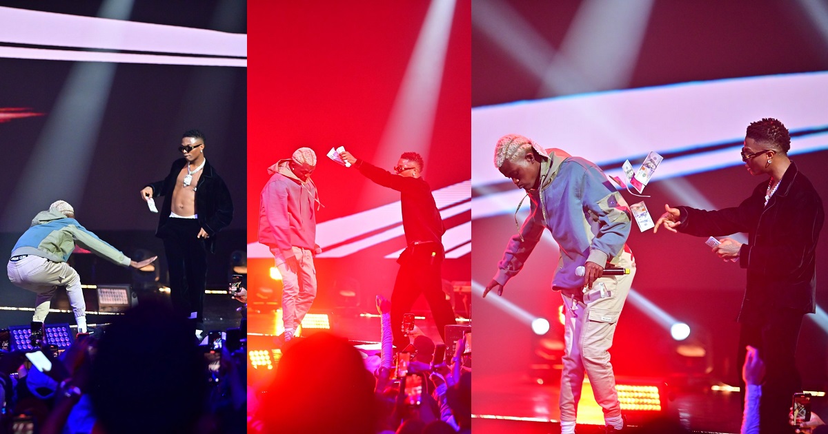 Moment Wizkid sprayed dollar bills on Zazu star, Portable during a concert (Watch)