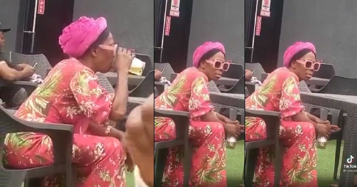 “Is that our Mummy G.O” – Nigerians react to a video of a woman drinking with a man at a Pub.