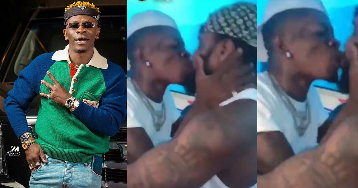 Shatta Wale seen kissing his male security guard, Shatta Kumoji, on the mouth after gifting him one of his diamond neck chains (video)