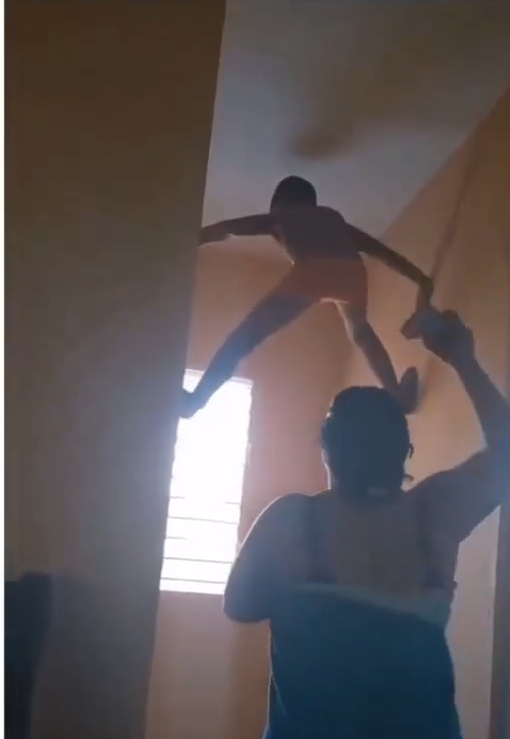 Moment little boy brings out ‘inner Spiderman’, sticks to the wall to escape being punished by his mother (video) 2 Moment little boy brings