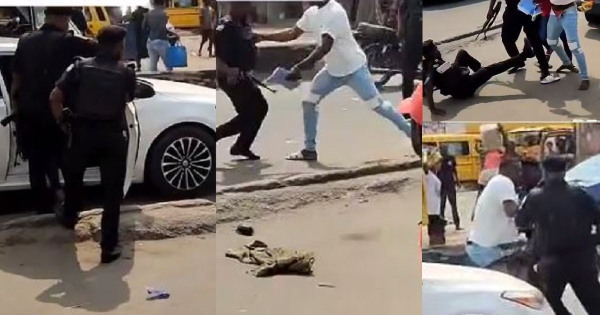 Young man fights armed police officers who allegedly tried to extort him despite having complete car papers in Lagos (video)