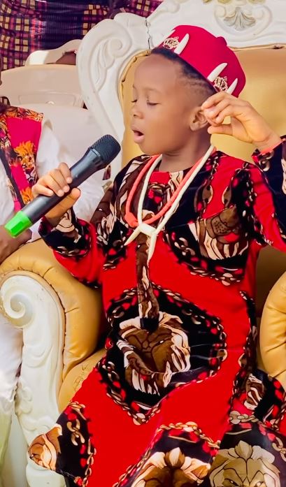 Proud father moment: Actor Jnr Pope’s son speaks Igbo fluently as he breaks bitter kola at a school function (video) 3 df4