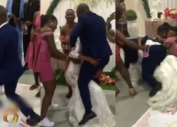 Moment couple suffered embarrassing fall while dancing at their wedding reception (Video)
