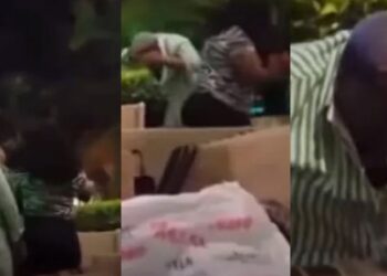 Husband flees as wife smashes bottle on side chic’s head after catching them in a hotel (Video)