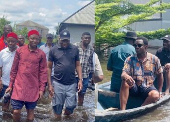 Reactions as Former President, Goodluck Jonathan enters a canoe in Bayelsa flood.