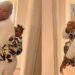 “UK will humble you” – Nigerian man says as he backs his child while wife is at work