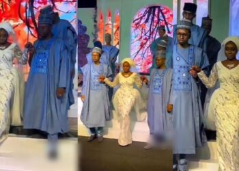 Heartwarming moment bride was walked down the aisle by her seven brothers (Video)