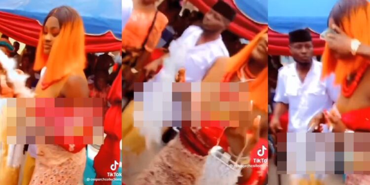 Woman spotted rubbing a bride’s face with money (video)