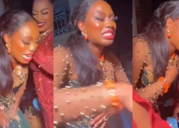 “You will never know disappointment” – Satisfied bride breaks down in tears as she prays for tailor who made her wedding dress (Video)
