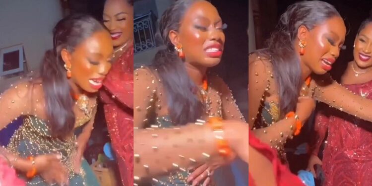 “You will never know disappointment” – Satisfied bride breaks down in tears as she prays for tailor who made her wedding dress (Video)