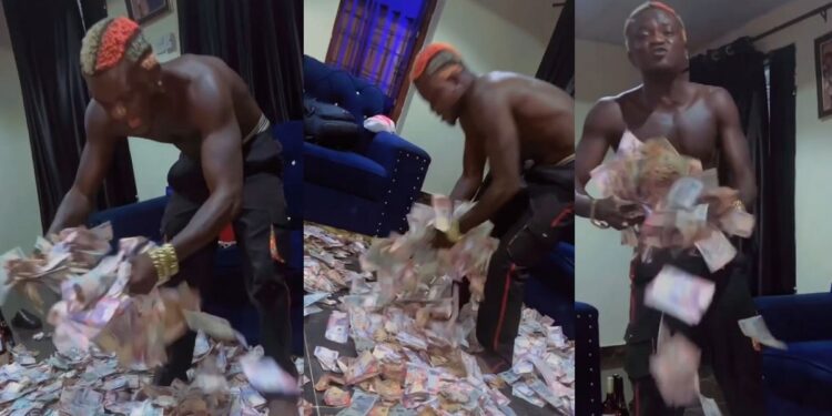 “Nobody has cashed out like me” – Singer Portable brags as he flaunts wads of cash fans sprayed him at an event (Video)