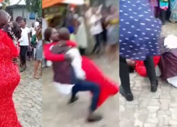 Embarrassing moment couple fell to the ground after groom attempted to carry his bride at their wedding (Video)